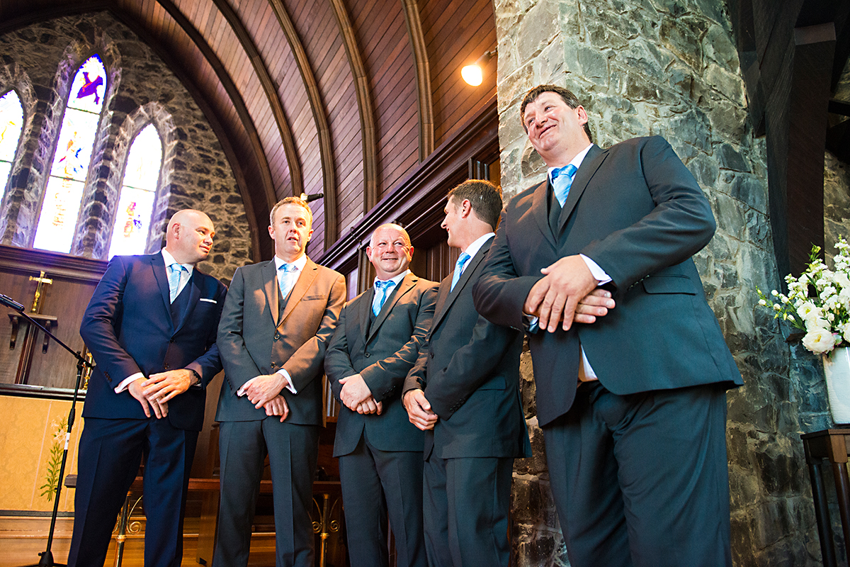 groom and bestmen in church waiting for bride paihia bay of islands