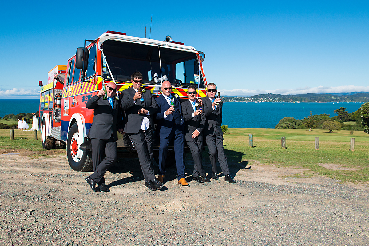 groom and his fire engine, beach, paihia, bay of islands